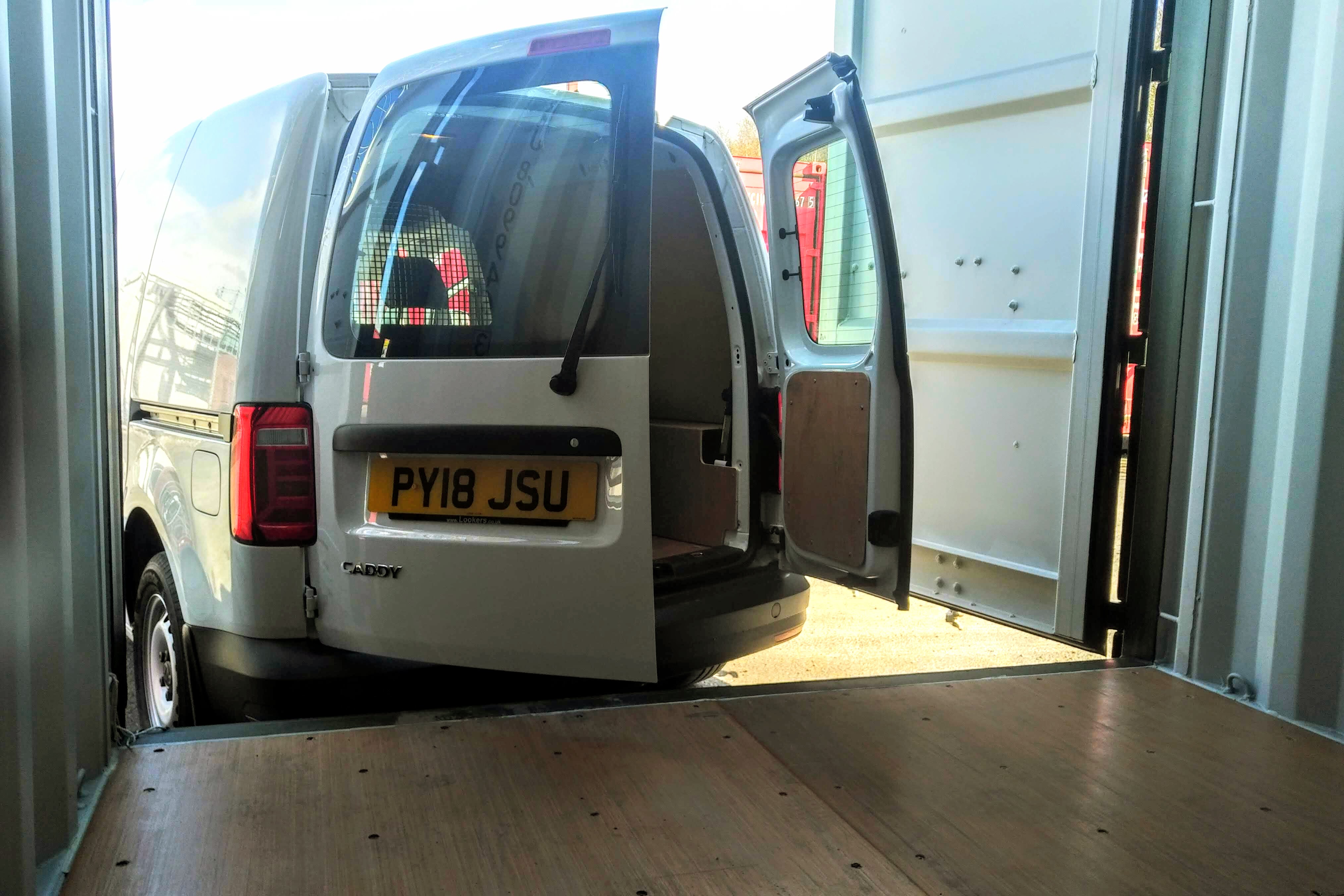 a van unloading contents on a self storage facility
